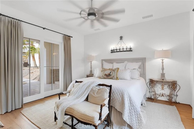 bedroom featuring ceiling fan, access to exterior, and light wood-type flooring