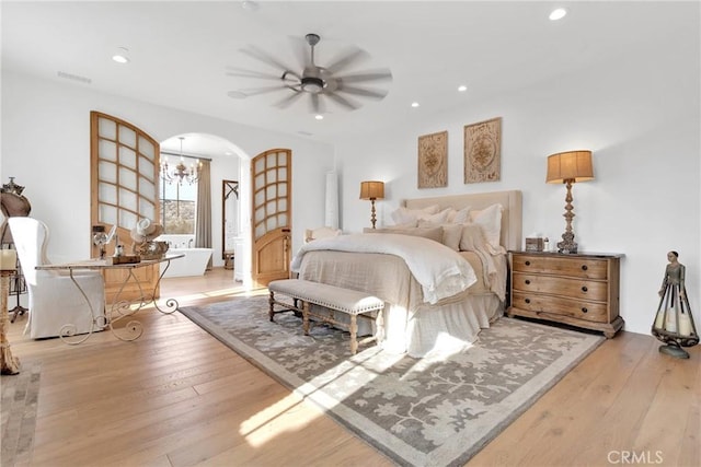 bedroom featuring light hardwood / wood-style floors and ceiling fan