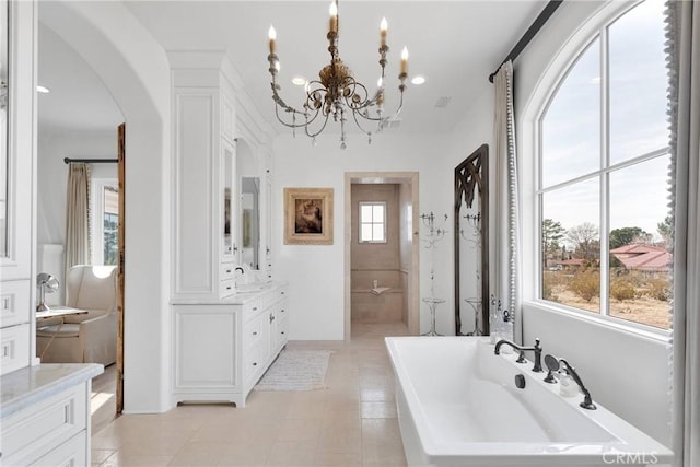 bathroom with vanity and a bathtub