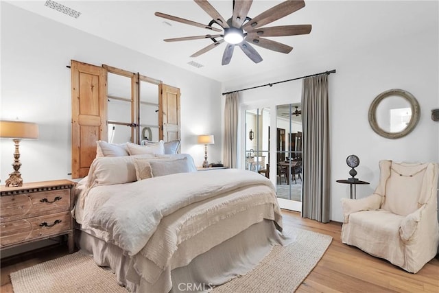 bedroom featuring ceiling fan, access to exterior, and light wood-type flooring