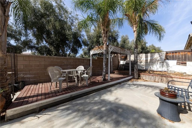 view of patio with a wooden deck and a gazebo