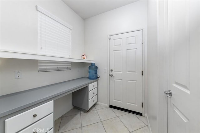 tiled office featuring built in desk