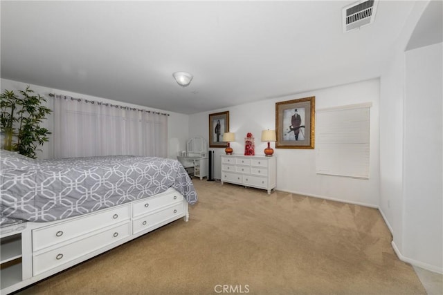 bedroom featuring light colored carpet