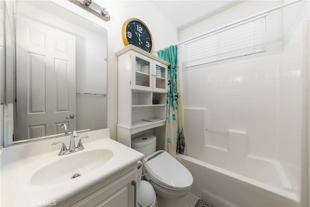 full bathroom featuring shower / tub combo, vanity, and toilet