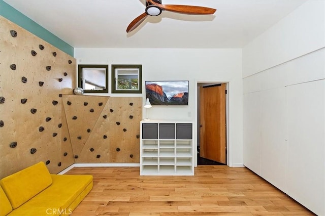 unfurnished room with light hardwood / wood-style floors and ceiling fan