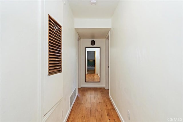 hall with light hardwood / wood-style flooring