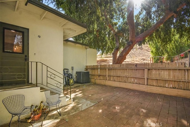 view of patio with central AC