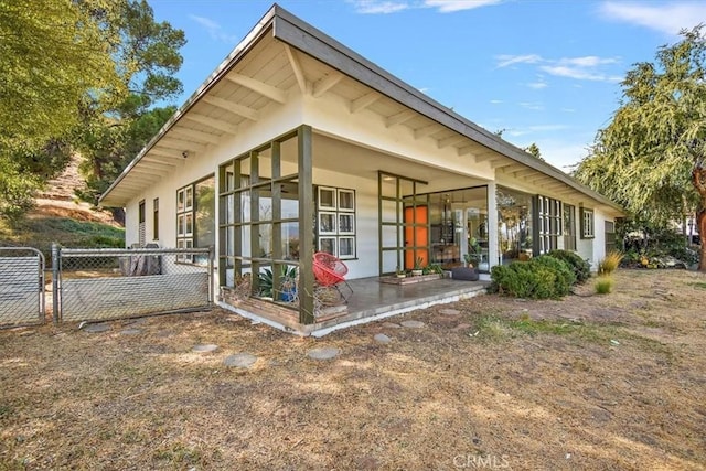 view of side of home featuring a patio