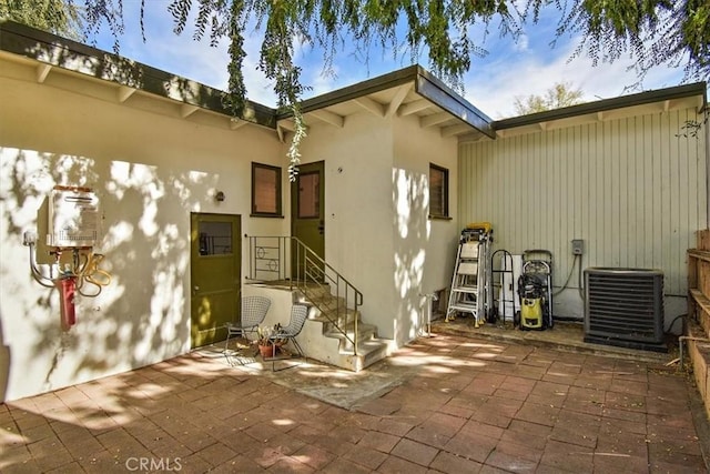 exterior space featuring a patio and central air condition unit