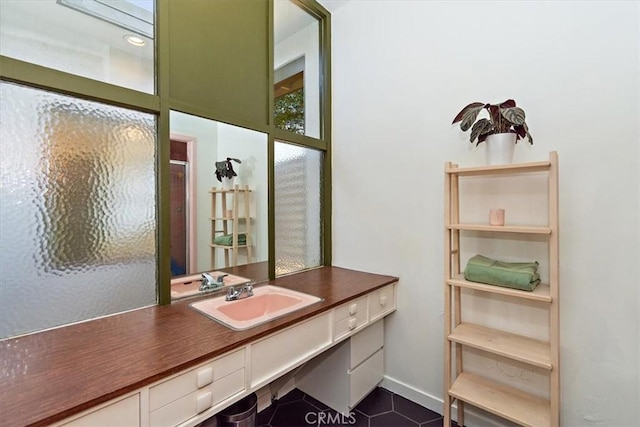 bathroom with vanity, tile patterned floors, and walk in shower