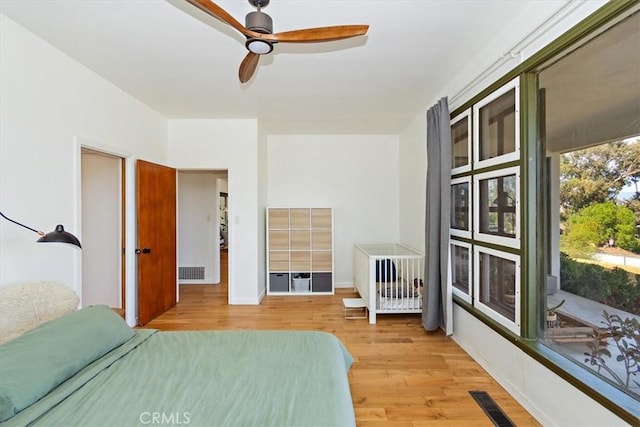 unfurnished bedroom with ceiling fan and light hardwood / wood-style floors