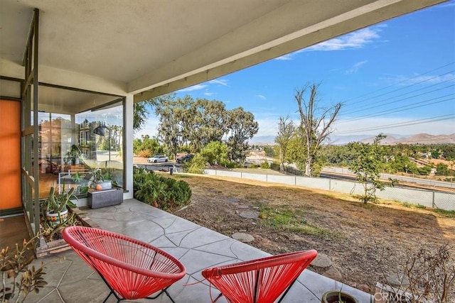 view of patio / terrace with a mountain view