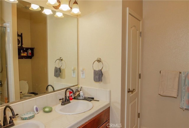 bathroom with vanity and walk in shower