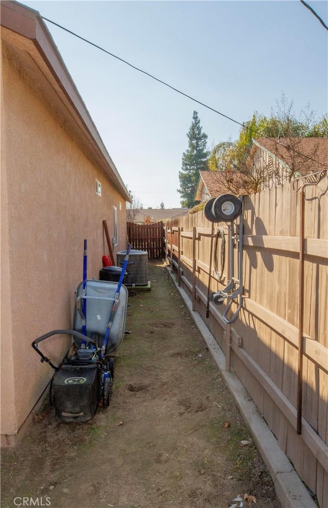 view of yard with central air condition unit