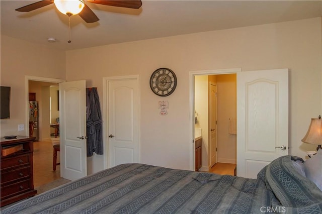 bedroom featuring ceiling fan and connected bathroom