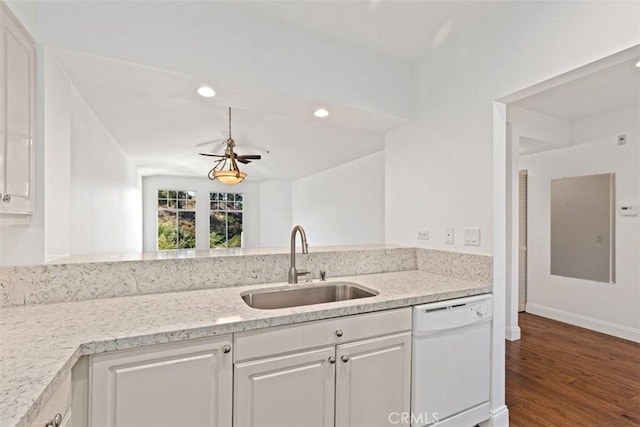 kitchen with sink, light stone countertops, white cabinets, and dishwasher