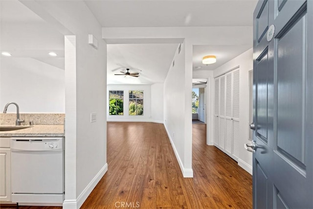 entryway with ceiling fan, dark hardwood / wood-style floors, and sink