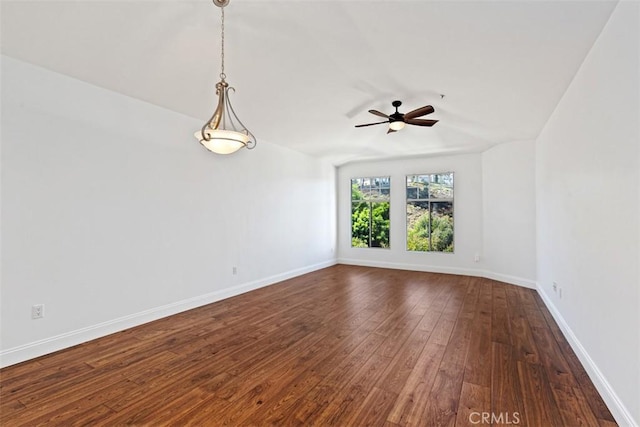 empty room with dark wood-type flooring and ceiling fan