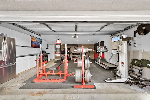 garage with stainless steel fridge