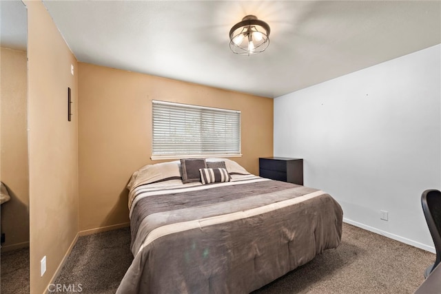 bedroom featuring dark colored carpet