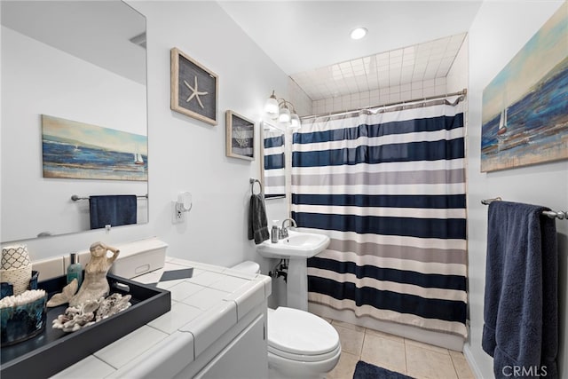 bathroom with curtained shower, tile patterned floors, and toilet