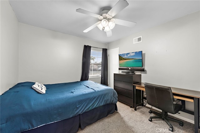 bedroom featuring light colored carpet and ceiling fan