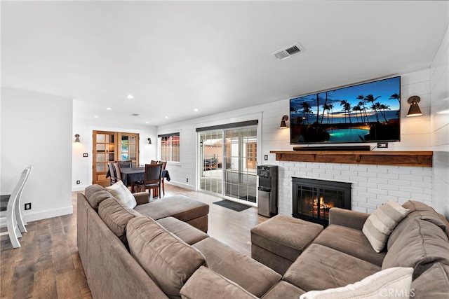 living room with a fireplace and hardwood / wood-style floors