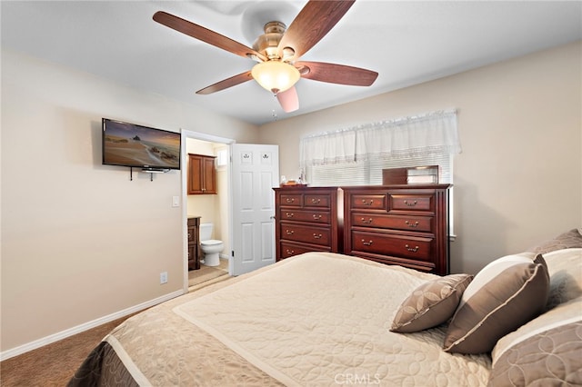 carpeted bedroom featuring ensuite bathroom and ceiling fan