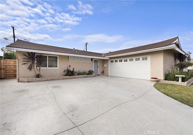 ranch-style home featuring a garage