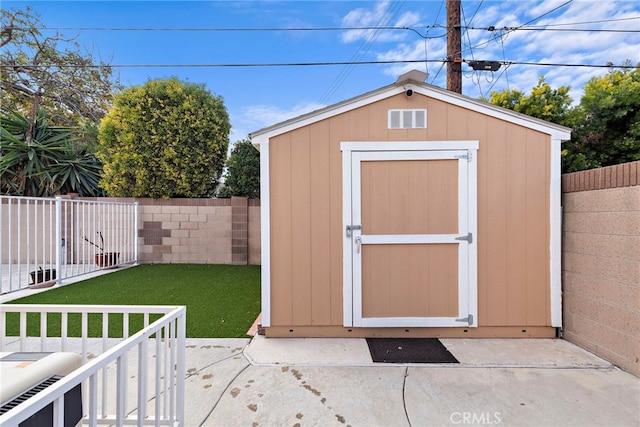 view of outdoor structure with a lawn