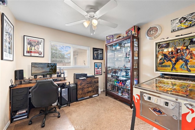 carpeted home office with ceiling fan