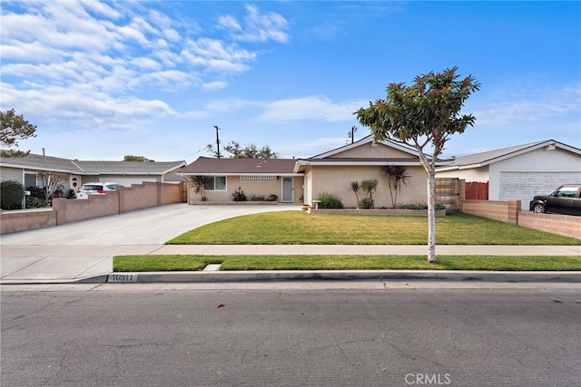 single story home featuring a garage and a front yard