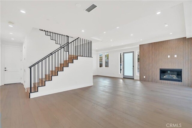 unfurnished living room featuring hardwood / wood-style floors