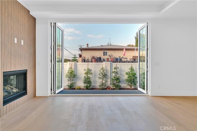 empty room with light hardwood / wood-style flooring