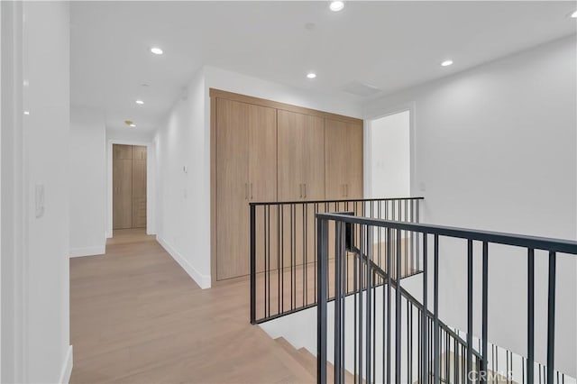 hall with light hardwood / wood-style floors