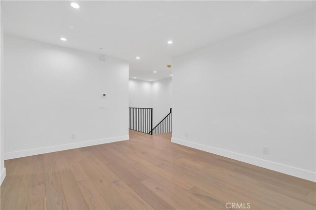 unfurnished room featuring light hardwood / wood-style floors