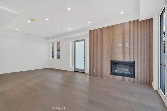 unfurnished living room with wood-type flooring