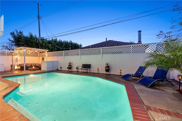 view of pool with a fenced backyard, a pergola, a patio, and a fenced in pool