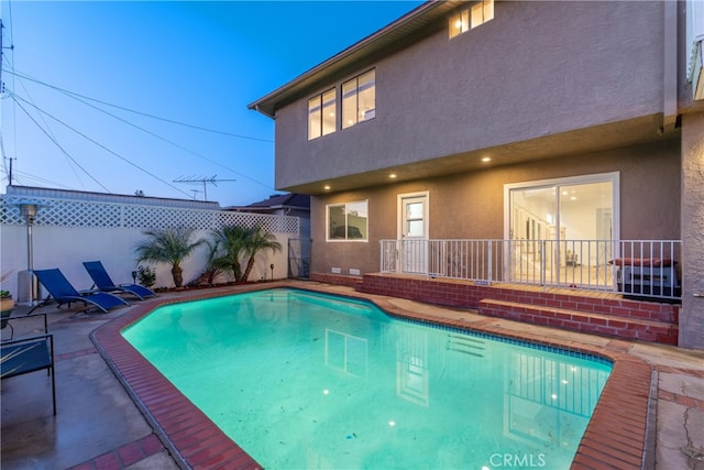 view of pool featuring a fenced backyard, a patio, and a fenced in pool
