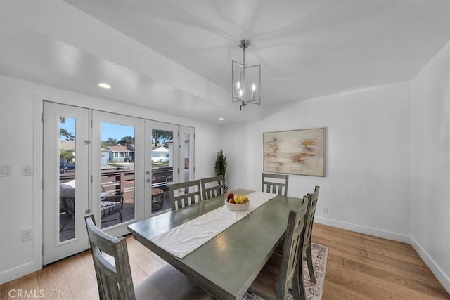 dining area featuring recessed lighting, light wood-style flooring, baseboards, and french doors