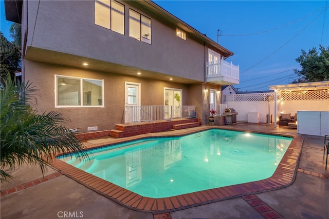 view of pool featuring a patio area, fence, and a fenced in pool