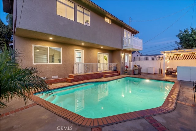 view of swimming pool featuring a fenced in pool, a patio area, and fence