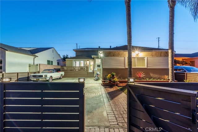 view of front of property featuring fence