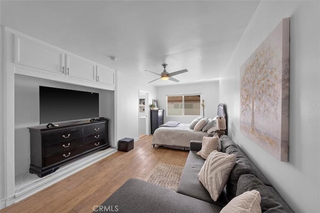 bedroom featuring light wood-style flooring and ceiling fan