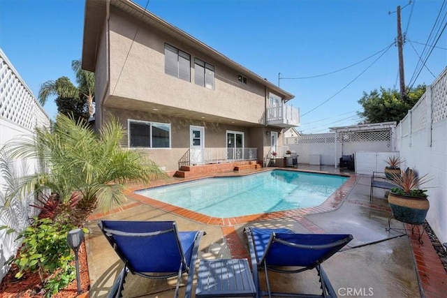 view of pool featuring a patio area, a fenced backyard, and a fenced in pool