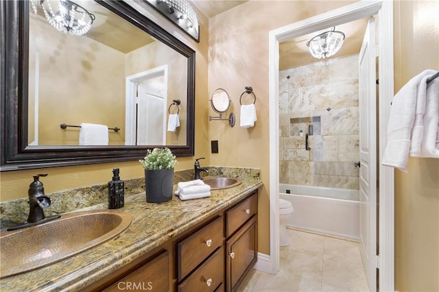 full bathroom featuring vanity, tile patterned flooring, bathing tub / shower combination, and toilet