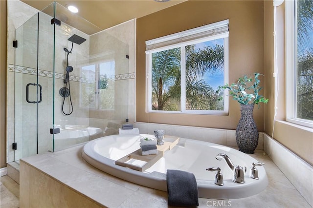 bathroom with shower with separate bathtub