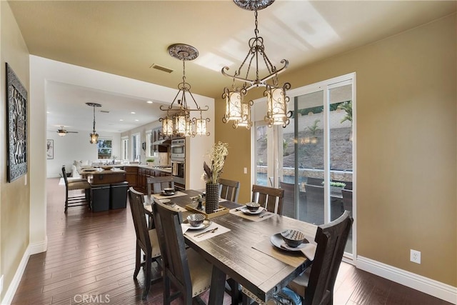 dining room featuring dark hardwood / wood-style floors and ceiling fan