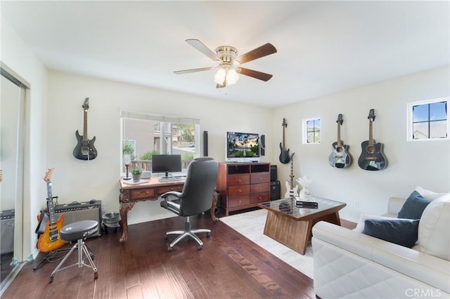 office area featuring dark hardwood / wood-style floors and ceiling fan