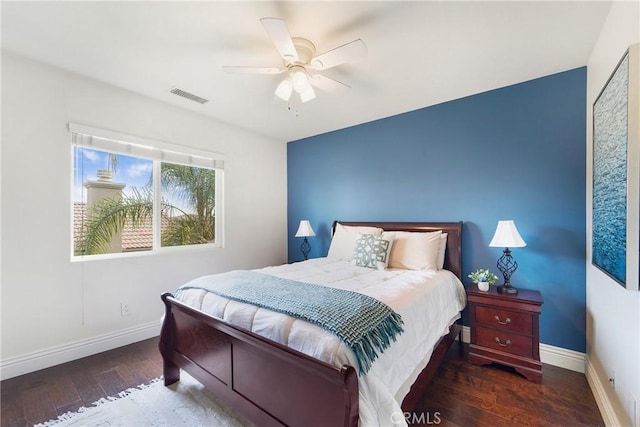 bedroom featuring dark hardwood / wood-style flooring and ceiling fan